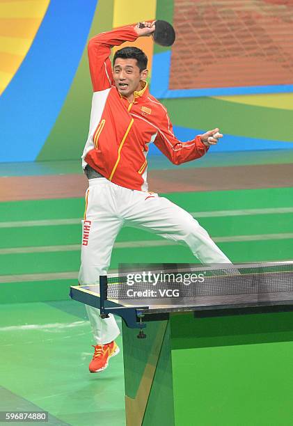 Table tennis player Zhang Jike performs during a demonstration on August 28, 2016 in Hong Kong, China. Chinese Mainland Olympians visit Hong Kong and...