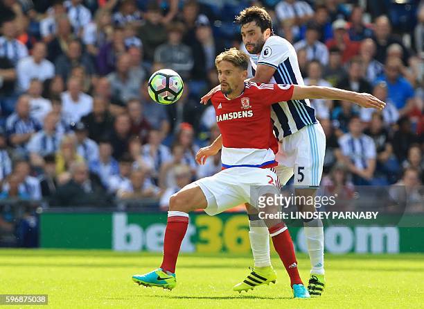 Middlesbrough's Uruguayan midfielder Gaston Ramírez vies with West Bromwich Albion's Argentinian midfielder Claudio Yacob during the English Premier...