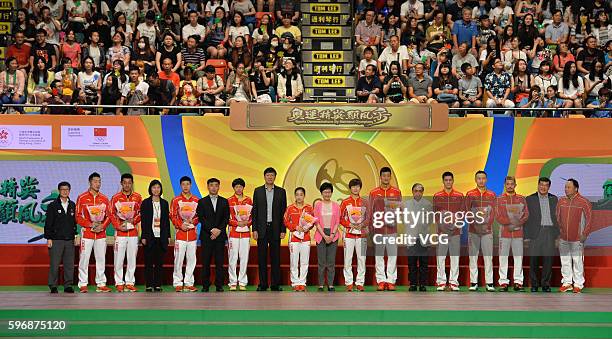 Chinese table tennis players and badminton players pose during a demonstration on August 28, 2016 in Hong Kong, China. Chinese Mainland Olympians...