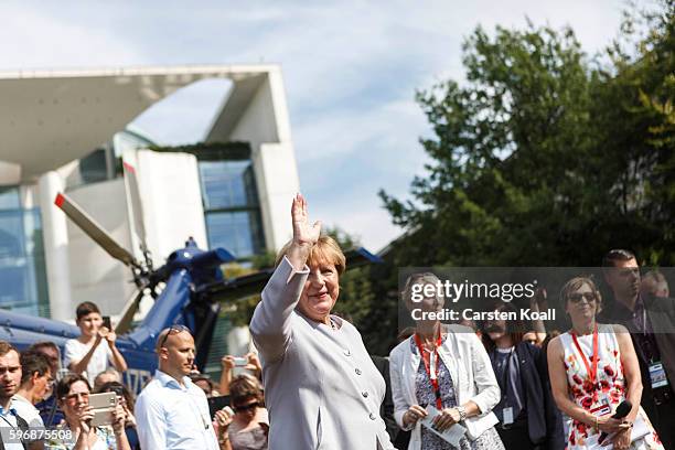 German Chancellor Angela Merkel greets members of the public who had come for the annual open-house day at the Chancellery on August 28, 2016 in...