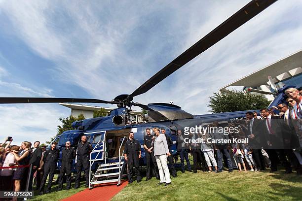 German Chancellor Angela Merkel speaks to members of the public who had come for the annual open-house day at the Chancellery on August 28, 2016 in...