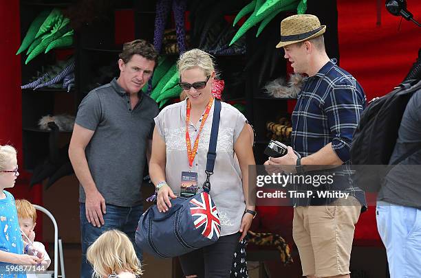 Jockey AP McCoy, Zara Tindall and Mike Tindall attend day three of The Big Feastival at Alex James' Farm on August 28, 2016 in Kingham, Oxfordshire.