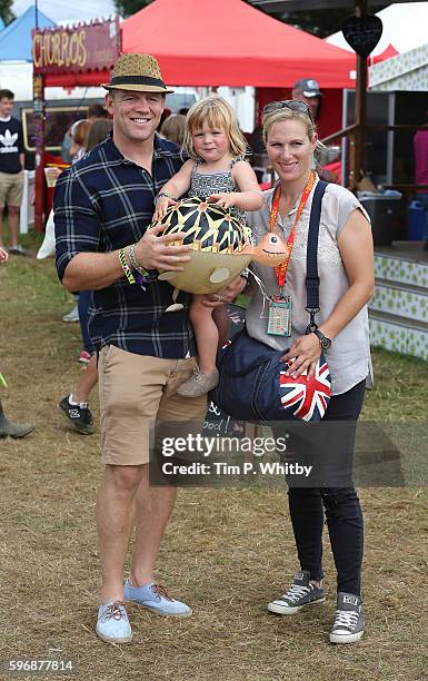 Mike Tindall, Zara Tindell and their daughter Mia Tindall pose for a photograph during day three of The Big Feastival at Alex James' Farm on August...