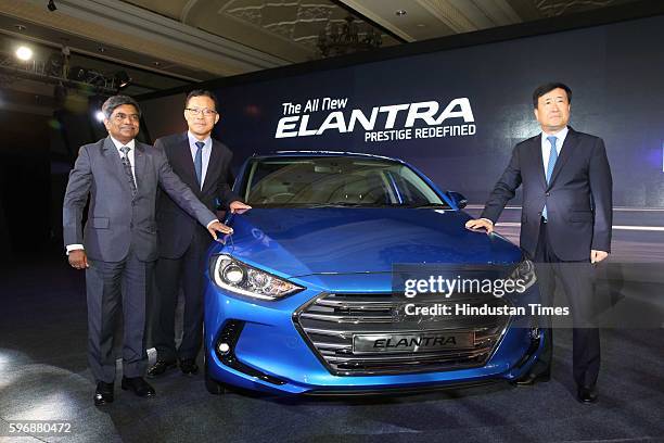 Rakesh Srivastava, senior VP , HMIL, BS Jeong, Director , and Hyundai Motor India MD and CEO YK Koo pose during the launch of new sixth generation...