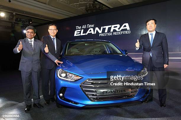 Rakesh Srivastava, senior VP , HMIL, BS Jeong, Director , and Hyundai Motor India MD and CEO YK Koo pose during the launch of new sixth generation...