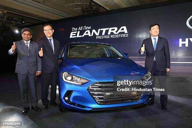 Rakesh Srivastava, senior VP , HMIL, BS Jeong, Director , and Hyundai Motor India MD and CEO YK Koo pose during the launch of new sixth generation...