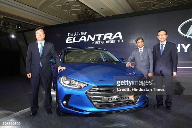 Hyundai Motor India MD and CEO YK Koo, Rakesh Srivastava, senior VP , HMIL and BS Jeong, Director pose during the launch of new sixth generation...