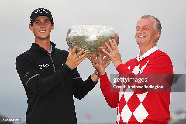 Thomas Pieters of Belgium poses with the trophy and Lars Larsen the owner of Himmerland Golf & Spa Resort following his victory during the final...