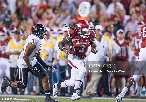 Arkansas Razorbacks running back Alex Collins finds room to run against the Texas Tech Red Raiders defense during the Texas Tech Red Raiders versus...