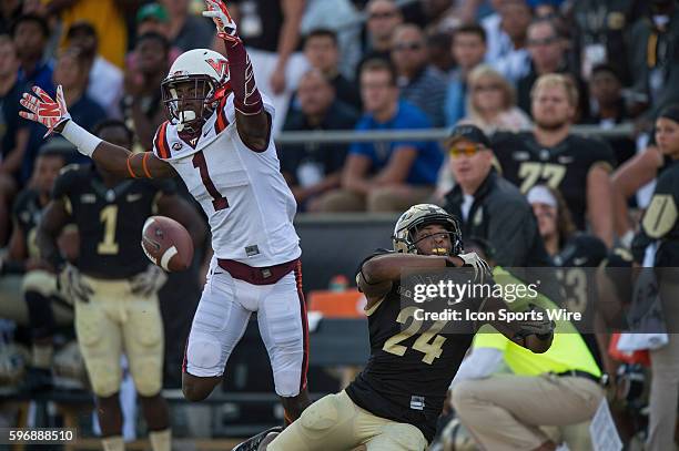 Purdue University cornerback Frankie Williams breaks up a pass intended for Virginia Tech Hokies wide receiver Isaiah Ford during a NCAA football...