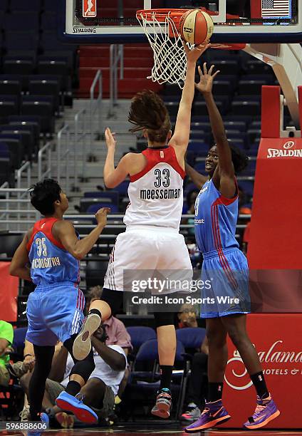 Washington Mystics center Emma Meesseman shoots over Atlanta Dream forward Aneika Henry during a WNBA basketball game at Verizon Center, in...