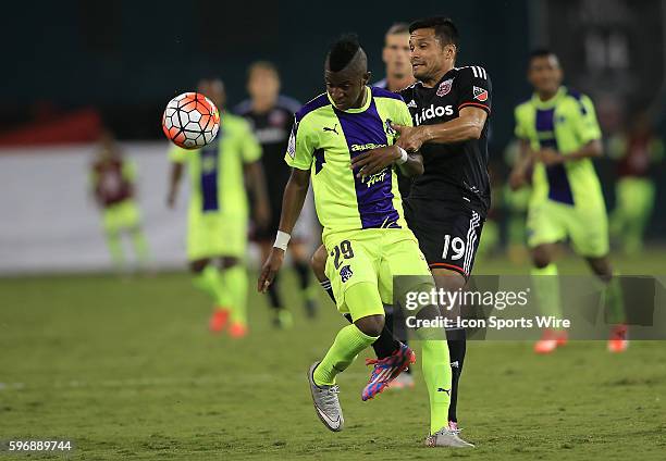 Jairo Arrieta of D.C United challenges for the ball with Daniel Ortíz of Arabe Unido during a CONCACAF champions league match at RFK Stadium, in...