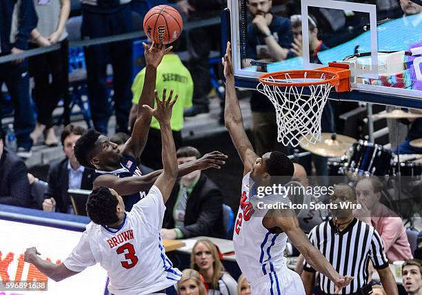 March 15, 2015. Connecticut Huskies forward Daniel Hamilton drives to the basket against SMU Mustangs guard Sterling Brown and SMU Mustangs center...