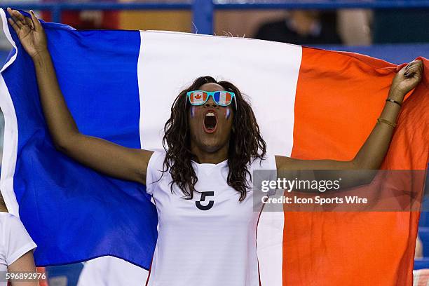 France fan cheers prior to the 2015 FIFA Women's World Cup Quarter final match between Germany and France at the Olympic Stadium in Montreal, Quebec,...
