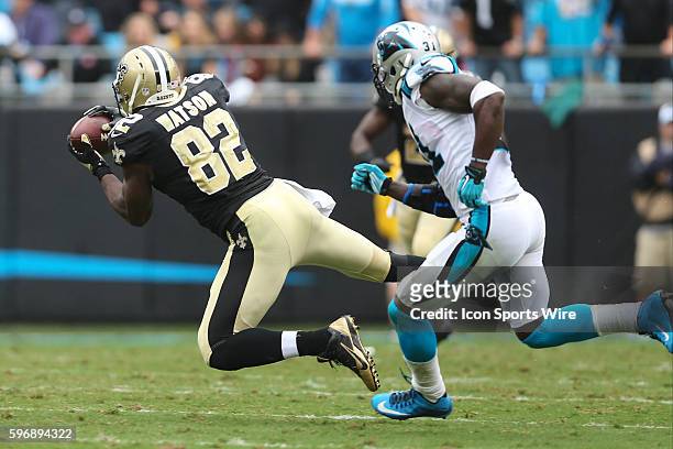 New Orleans Saints tight end Benjamin Watson makes a catch guarded by Carolina Panthers cornerback Charles Tillman in the second quarter between the...