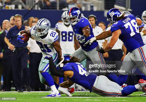 Dallas Cowboys running back Joseph Randle is tackled by New York Giants linebacker Uani' Unga during a NFL regular season game between the New York...