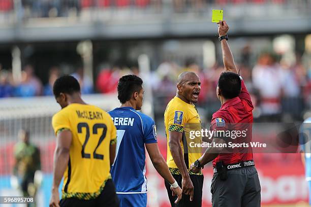 Jamaica's defender Rudolph Austin receives a yellow card during the first half at the CONCACAF Gold Cup game between Jamaica and El Salvador at BMO...