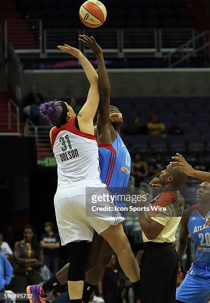 Washington Mystics center Stefanie Dolson and Atlanta Dream forward Aneika Henry go up for the ball during a WNBA basketball game at Verizon Center,...