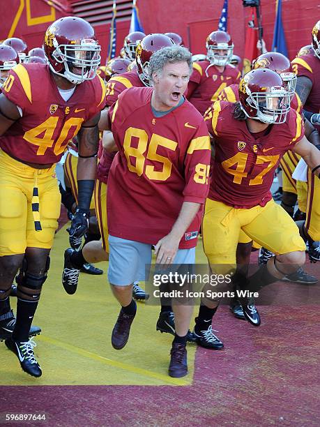 Actor Will Ferrell leads the USC Trojans onto their field before the start of a game against the Stanford Cardinal played at the Los Angeles Memorial...