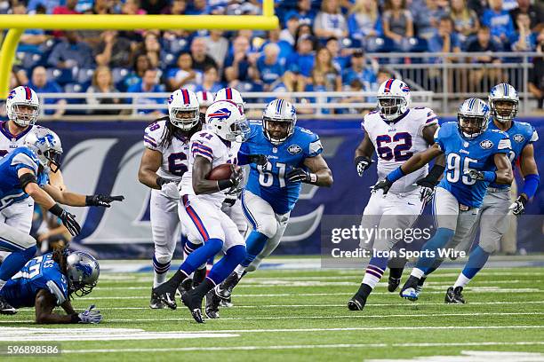 Detroit Lions defensive tackle Kerry Hyder and Detroit Lions linebacker Brandon Copeland chase after Buffalo Bills running back Cierre Wood during...