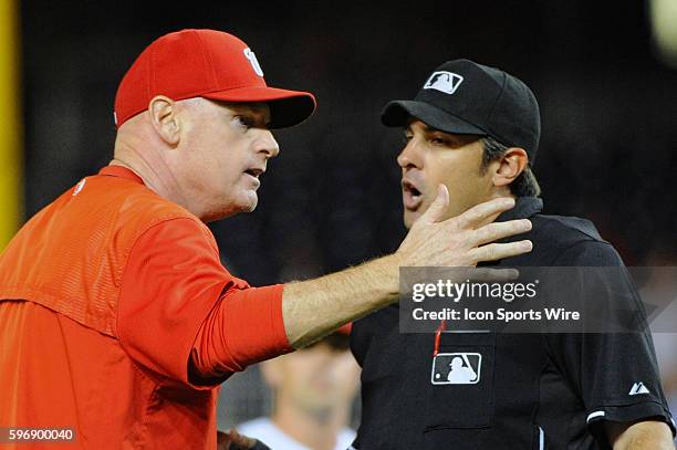 Washington Nationals manager Matt Williams argues with home plate umpire Mark Ripperger after a pitcher was ejected during the game against the...