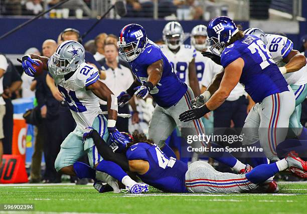 Dallas Cowboys running back Joseph Randle is tackled by New York Giants linebacker Uani' Unga during a NFL regular season game between the New York...