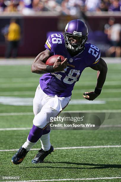 Minnesota Vikings running back Adrian Peterson runs with the ball. The Minnesota Vikings defeated the San Diego Chargers by a score of 31 to 14 at...