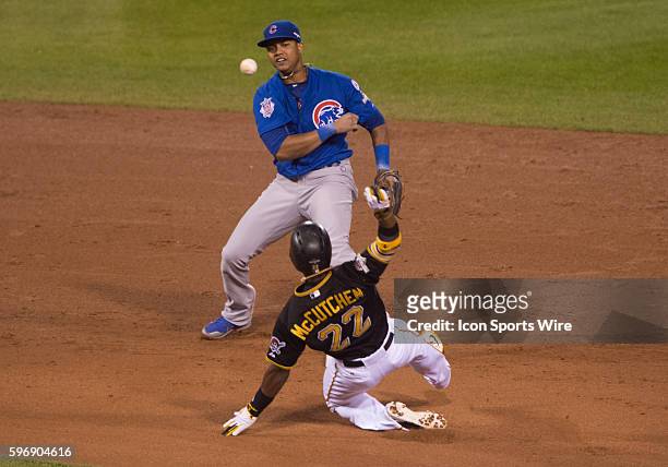 Chicago Cubs shortstop Starlin Castro turns a double play during the National League Wild Card game between the Chicago Cubs and Pittsburgh Pirates...