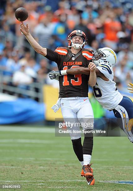Cleveland Browns quarterback Josh McCown is hit by San Diego Chargers cornerback Patrick Robinson as he releases the ball during a game played at...