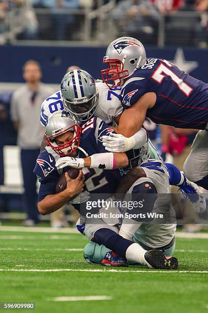 Dallas Cowboys defensive end Greg Hardy and middle linebacker Rolando McClain sack New England Patriots quarterback Tom Brady during the game between...