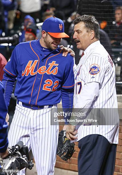 First baseman for the 1986 World Champion Mets, Keith Hernandez has a word with New York Mets catcher Kevin Plawecki [9785] prior to throwing out the...
