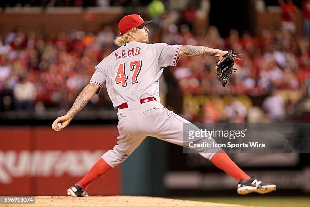 Cincinnati Reds starting pitcher John Lamb delivers a pitch during the game between the Cincinnati Reds and St. Louis Cardinals at Busch Stadium in...