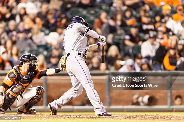 Colorado Rockies left fielder Corey Dickerson doubles during the fifth inning of the regular season MLB game between the San Francisco Giants and the...
