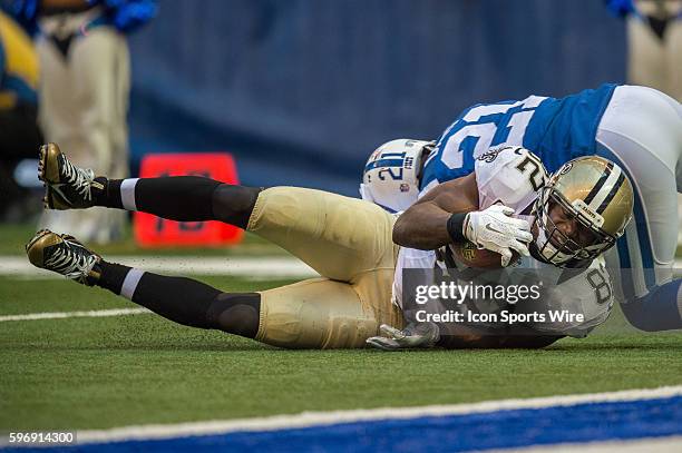 New Orleans Saints tight end Benjamin Watson catches a pass in front of Indianapolis Colts cornerback Vontae Davis during a NFL game between the...