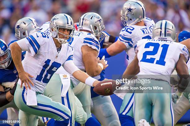 Dallas Cowboys quarterback Matt Cassel hands off to Dallas Cowboys running back Joseph Randle during the NFL game between the Dallas Cowboys and the...