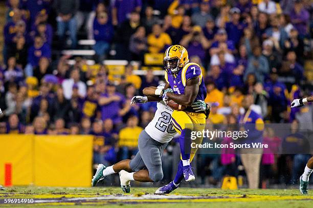 Tigers running back Leonard Fournette is tackled by Eastern Michigan Eagles linebacker Amos Houston during the game between the LSU Tigers and...