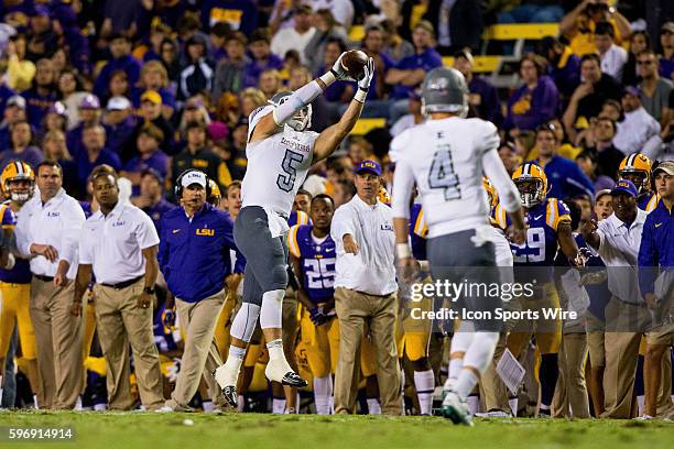 Eastern Michigan Eagles tight end Cody Tuttle catches a pass infant of the LSU Tigers sidelines during the game between the LSU Tigers and Eastern...