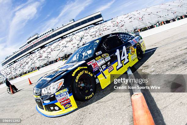 Sprint Cup Series driver, Tony Stewart, driver of the Code 3 Associates/Mobil 1 Chevy heads back into the garage during Saturday afternoon's practice...