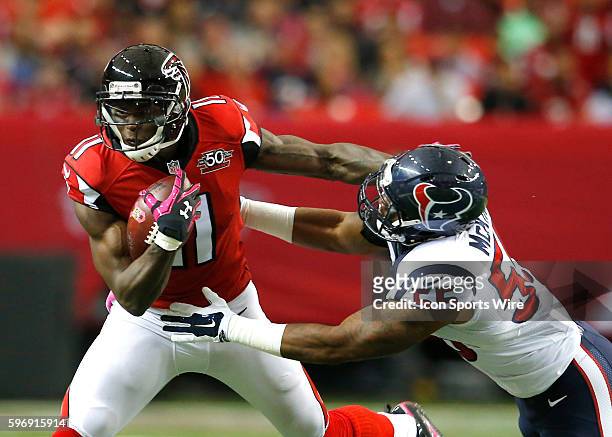 Atlanta Falcons wide receiver Julio Jones fights off Houston Texans inside linebacker Benardrick McKinney in first half action of the Houston Texans...