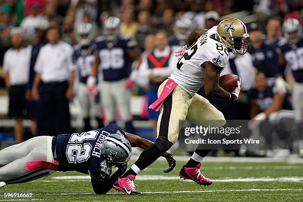 New Orleans Saints Tight End Benjamin Watson runs past Dallas Cowboys Safety Barry Church at the Mercedes-Benz Superdome in New Orleans, LA.