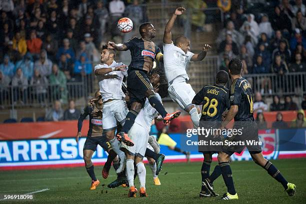 Union D Maurice Edu defends a header against several Kansas City players in overtime during the game between Sporting Kansas City and The...