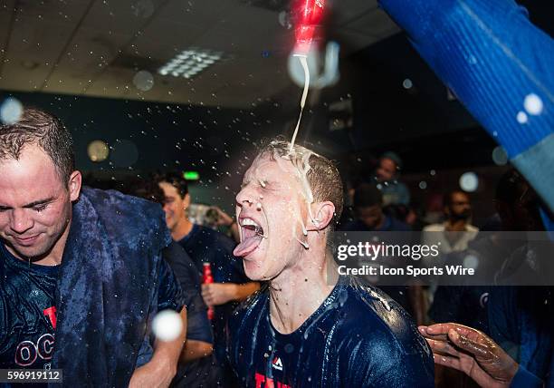 Chicago Cubs left fielder Chris Coghlan has beer poured on him as the Chicago Cubs celebrate after defeating the Pittsburgh Pirates 4-0 in the...