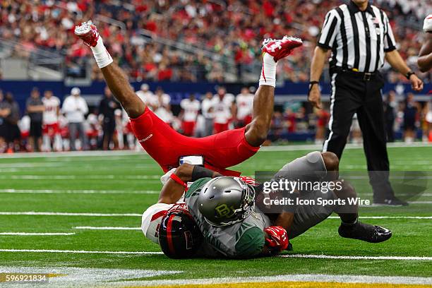 Baylor Bears wide receiver Corey Coleman scores a touchdown with Texas Tech Red Raiders defensive back Justis Nelson defending during the Texas Farm...