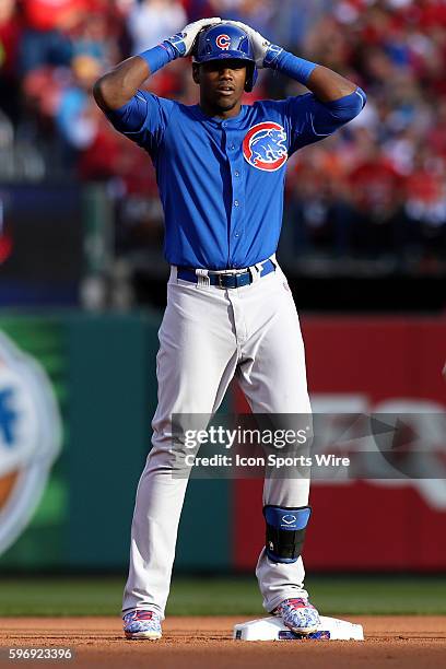 Chicago Cubs right fielder Jorge Soler celebrates with his hands on his helmet after hitting a double during the first inning of game two of...