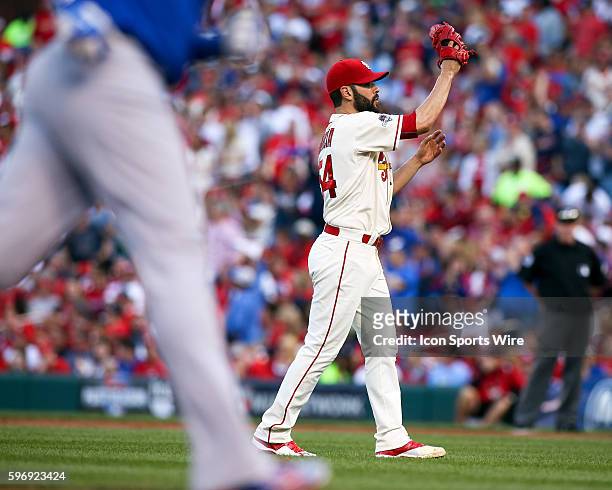 St. Louis Cardinals starting pitcher Jaime Garcia catches a new baseball after giving up a home run to Chicago Cubs right fielder Jorge Soler during...