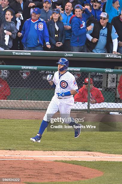 Javier Baez pumping his fist after hitting a three run homer in game 4, of the NLDS, in a game between the St Louis Cardinals, and the Chicago Cubs,...