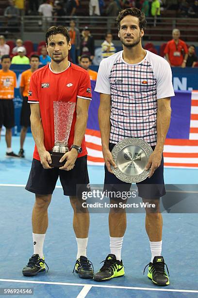 David Ferrer of Spain and Feliciano Lopez of Spain pose for photograph after the completion of the final match of ATP World Tour 250 Malaysian Open,...