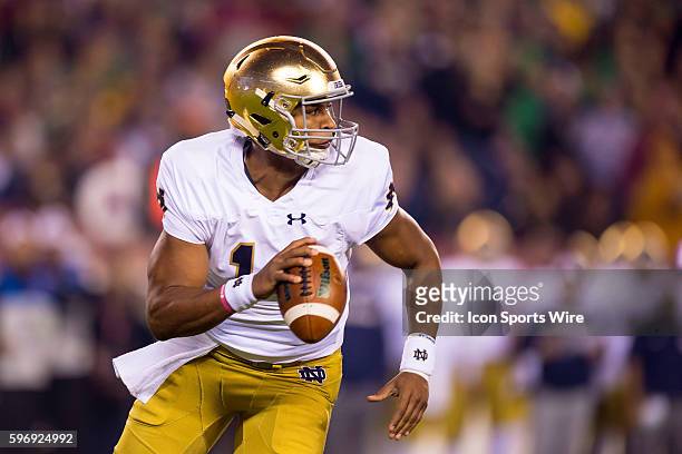 Notre Dame Fighting Irish quarterback DeShone Kizer scrambles out of the pocket during the NCAA Football game between the Temple Owls and the Notre...