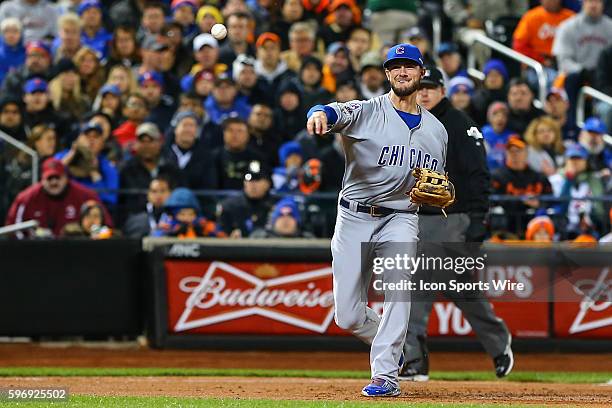 Chicago Cubs third baseman Kris Bryant throws the ball to first base after making a play during Game 1 of the National League Championship Series...