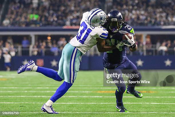 Seattle Seahawks running back Marshawn Lynch gets tackled by Dallas Cowboys cornerback Byron Jones during the game between the Dallas Cowboys and the...